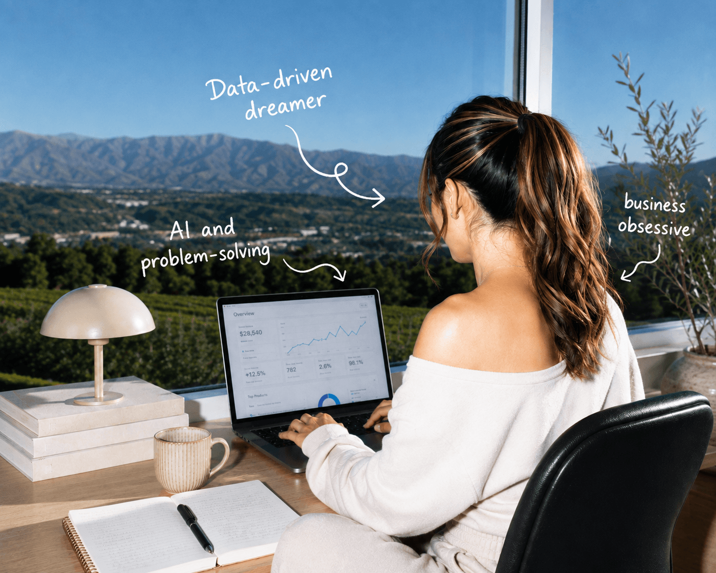 Sachi working at her desk with her laptop